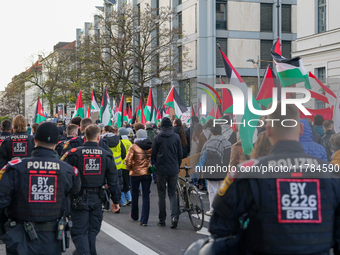 A demonstration in Munich, Germany, on November 16, 2024, includes pro-Palestinian demonstrators and pro-Israeli counter-demonstrators with...