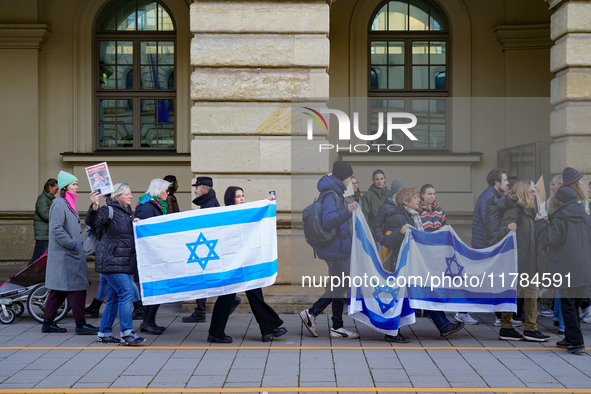 A demonstration in Munich, Germany, on November 16, 2024, includes pro-Palestinian demonstrators and pro-Israeli counter-demonstrators with...