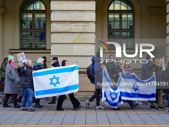 A demonstration in Munich, Germany, on November 16, 2024, includes pro-Palestinian demonstrators and pro-Israeli counter-demonstrators with...