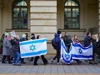 A demonstration in Munich, Germany, on November 16, 2024, includes pro-Palestinian demonstrators and pro-Israeli counter-demonstrators with...