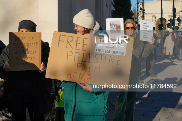 A demonstration in Munich, Germany, on November 16, 2024, includes pro-Palestinian demonstrators and pro-Israeli counter-demonstrators with...