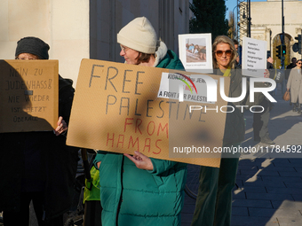 A demonstration in Munich, Germany, on November 16, 2024, includes pro-Palestinian demonstrators and pro-Israeli counter-demonstrators with...