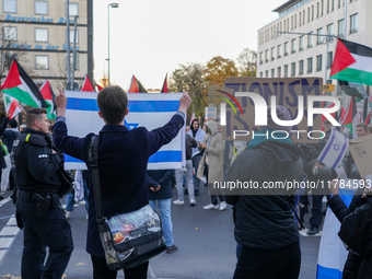 A demonstration in Munich, Germany, on November 16, 2024, includes pro-Palestinian demonstrators and pro-Israeli counter-demonstrators with...