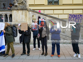 A demonstration in Munich, Germany, on November 16, 2024, includes pro-Palestinian demonstrators and pro-Israeli counter-demonstrators with...