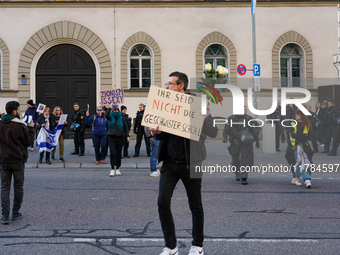 A demonstration in Munich, Germany, on November 16, 2024, includes pro-Palestinian demonstrators and pro-Israeli counter-demonstrators with...