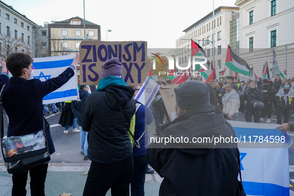 A demonstration in Munich, Germany, on November 16, 2024, includes pro-Palestinian demonstrators and pro-Israeli counter-demonstrators with...