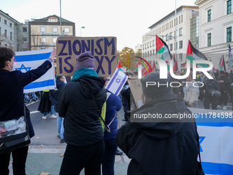 A demonstration in Munich, Germany, on November 16, 2024, includes pro-Palestinian demonstrators and pro-Israeli counter-demonstrators with...