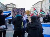 A demonstration in Munich, Germany, on November 16, 2024, includes pro-Palestinian demonstrators and pro-Israeli counter-demonstrators with...