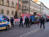 A demonstration in Munich, Germany, on November 16, 2024, includes pro-Palestinian demonstrators and pro-Israeli counter-demonstrators with...