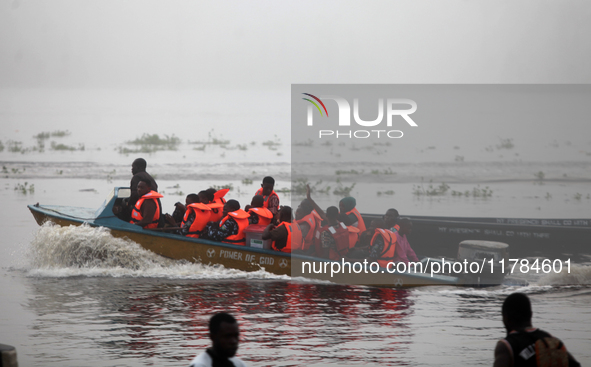 Officials of INEC in a boat in Ugbonla, Ilaje, Local Government Area, Ondo State, Nigeria, on November 16, 2024, take election materials to...