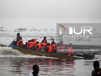 Officials of INEC in a boat in Ugbonla, Ilaje, Local Government Area, Ondo State, Nigeria, on November 16, 2024, take election materials to...