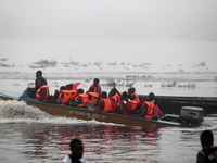 Officials of INEC in a boat in Ugbonla, Ilaje, Local Government Area, Ondo State, Nigeria, on November 16, 2024, take election materials to...