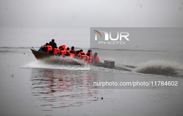 Officials of INEC in a boat in Ugbonla, Ilaje, Local Government Area, Ondo State, Nigeria, on November 16, 2024, take election materials to...