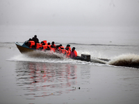 Officials of INEC in a boat in Ugbonla, Ilaje, Local Government Area, Ondo State, Nigeria, on November 16, 2024, take election materials to...