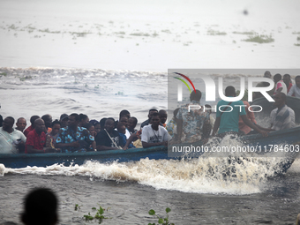 Residents in a boat in Ugbonla, Ilaje, Local Government Area, Ondo State, Nigeria, head to their polling unit during the 2024 Governorship e...