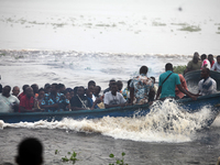 Residents in a boat in Ugbonla, Ilaje, Local Government Area, Ondo State, Nigeria, head to their polling unit during the 2024 Governorship e...