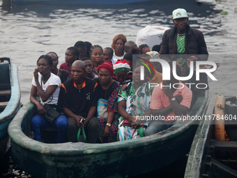 Residents in a boat in Ugbonla, Ilaje, Local Government Area, Ondo State, Nigeria, head to their polling unit during the 2024 Governorship e...