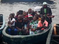 Residents in a boat in Ugbonla, Ilaje, Local Government Area, Ondo State, Nigeria, head to their polling unit during the 2024 Governorship e...