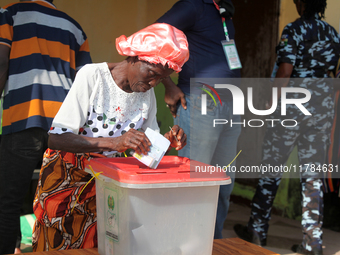 A woman votes during the 2024 Governorship election for Ondo State in Obenla, Ilaje, Local Government Area, Ondo State, Nigeria, on November...