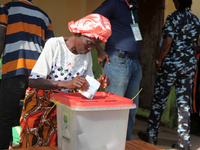 A woman votes during the 2024 Governorship election for Ondo State in Obenla, Ilaje, Local Government Area, Ondo State, Nigeria, on November...