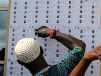 A traditional chief checks his name on voters' lists during the 2024 Governorship election for Ondo State in Obenla, Ilaje, Local Government...