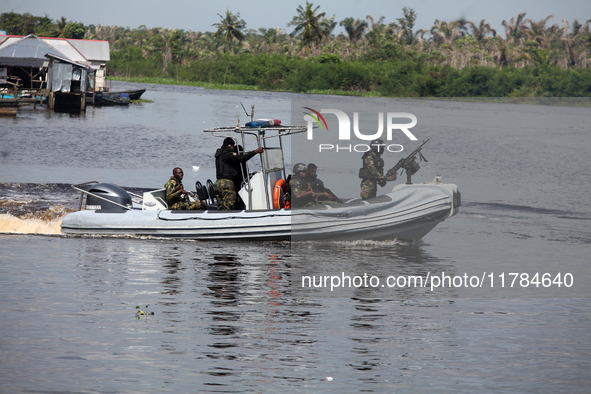 Military personnel patrol on the water during the 2024 Governorship election for Ondo State in Obenla, Ilaje, Local Government Area, Ondo St...