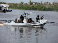 Military personnel patrol on the water during the 2024 Governorship election for Ondo State in Obenla, Ilaje, Local Government Area, Ondo St...