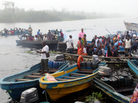 Residents in a boat in Ugbonla, Ilaje, Local Government Area, Ondo State, Nigeria, head to their polling unit during the 2024 Governorship e...