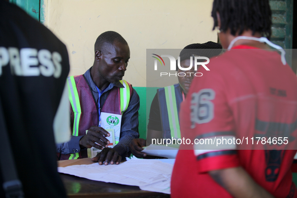 An INEC official writes election results at Ward 2, Unity 6 during the 2024 Governorship election for Ondo State in Ugbonla, Ilaje, Local Go...