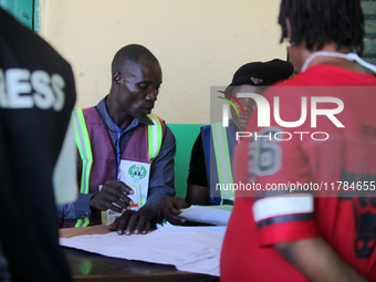 An INEC official writes election results at Ward 2, Unity 6 during the 2024 Governorship election for Ondo State in Ugbonla, Ilaje, Local Go...