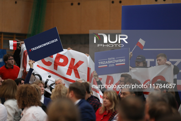 In Krakow, Poland, on November 16, 2024, people with a banner and hats with the inscription 'Mentzen 2025' disrupt the event during a meetin...