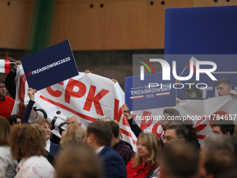 In Krakow, Poland, on November 16, 2024, people with a banner and hats with the inscription 'Mentzen 2025' disrupt the event during a meetin...