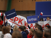 In Krakow, Poland, on November 16, 2024, people with a banner and hats with the inscription 'Mentzen 2025' disrupt the event during a meetin...