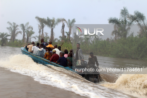 Residents in a boat in Ugbonla, Ilaje, Local Government Area, Ondo State, Nigeria, head to their polling unit during the 2024 Governorship e...