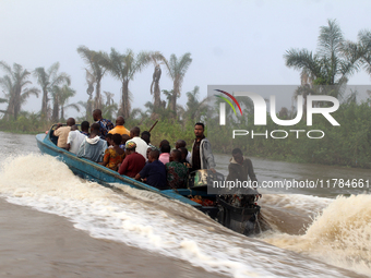 Residents in a boat in Ugbonla, Ilaje, Local Government Area, Ondo State, Nigeria, head to their polling unit during the 2024 Governorship e...