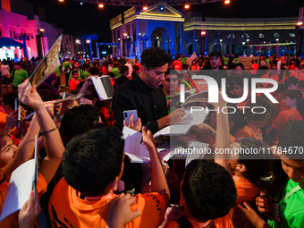 Nadir Nahdi signs autographs for fans during the ''Sudan, Remember Us'' screening on the opening night of the Ajyal Film Festival 2024 prese...