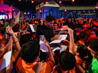 Nadir Nahdi signs autographs for fans during the ''Sudan, Remember Us'' screening on the opening night of the Ajyal Film Festival 2024 prese...