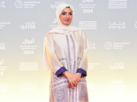 Fatma Al Remaihi, CEO of the Doha Film Institute, attends the ''Sudan, Remember Us'' red carpet during the screening on the opening night of...