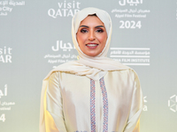 Fatma Al Remaihi, CEO of the Doha Film Institute, attends the ''Sudan, Remember Us'' red carpet during the screening on the opening night of...