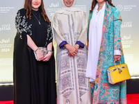 Fatma Al Remaihi, CEO of the Doha Film Institute, and Salam Shawa attend the 'Sudan, Remember Us' red carpet during the screening on the ope...