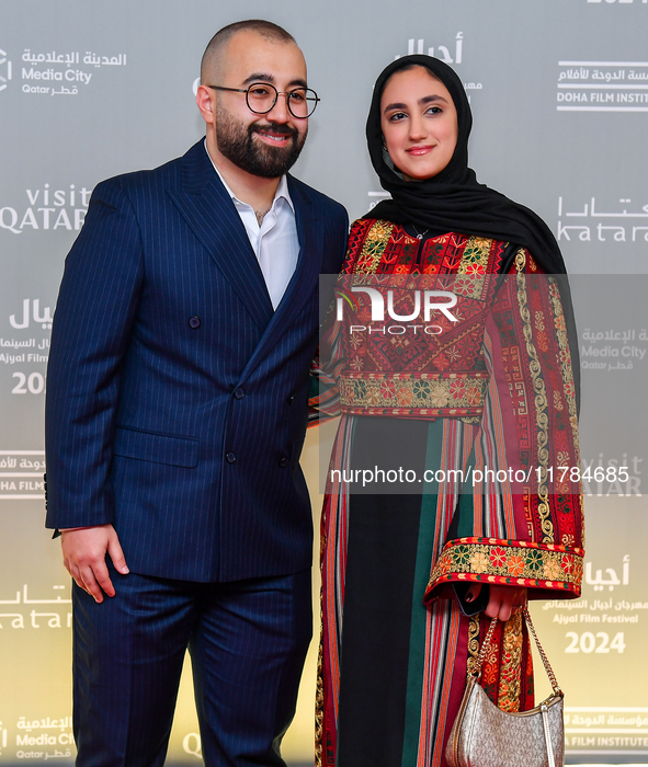 Directors Obada Al-Jarbi and a guest attend the ''Sudan, Remember Us'' red carpet during the screening on the opening night of the Ajyal Fil...