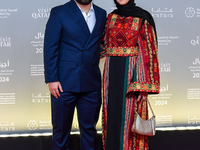 Directors Obada Al-Jarbi and a guest attend the ''Sudan, Remember Us'' red carpet during the screening on the opening night of the Ajyal Fil...