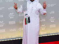 Qatari artist Hamad Al-Ammari attends the 'Sudan, Remember Us' red carpet during the screening on the opening night of the Ajyal Film Festiv...