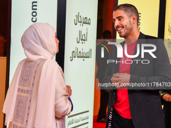 Fatma Al Remaihi, CEO of the Doha Film Institute, and Ahmed Shihab-Eldin attend the 'Sudan, Remember Us' red carpet during the screening on...