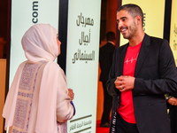 Fatma Al Remaihi, CEO of the Doha Film Institute, and Ahmed Shihab-Eldin attend the 'Sudan, Remember Us' red carpet during the screening on...