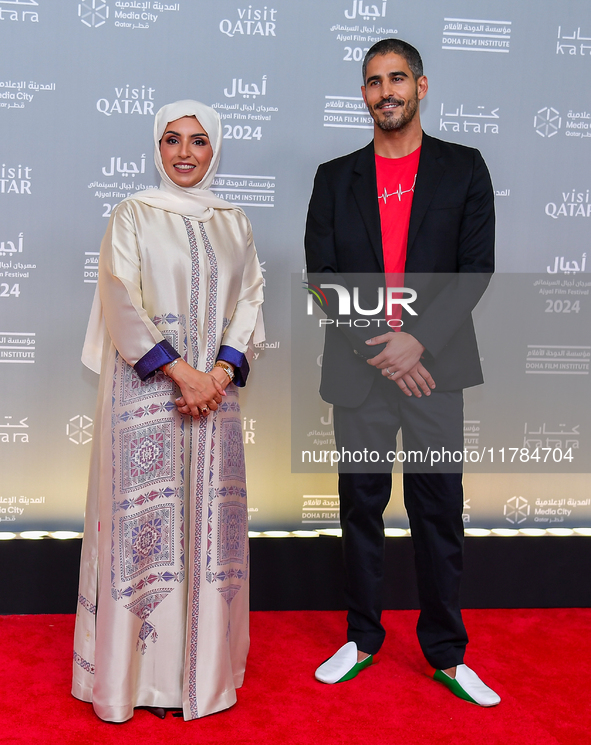 Fatma Al Remaihi, CEO of the Doha Film Institute, and Ahmed Shihab-Eldin attend the 'Sudan, Remember Us' red carpet during the screening on...