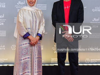 Fatma Al Remaihi, CEO of the Doha Film Institute, and Ahmed Shihab-Eldin attend the 'Sudan, Remember Us' red carpet during the screening on...