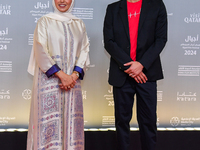 Fatma Al Remaihi, CEO of the Doha Film Institute, and Ahmed Shihab-Eldin attend the 'Sudan, Remember Us' red carpet during the screening on...