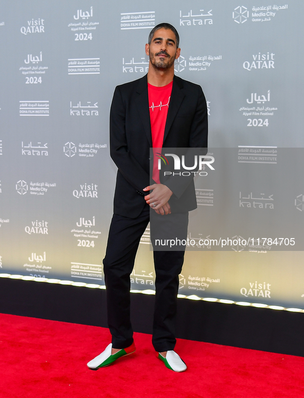 Fatma Al Remaihi, CEO of the Doha Film Institute, and Ahmed Shihab-Eldin attend the 'Sudan, Remember Us' red carpet during the screening on...