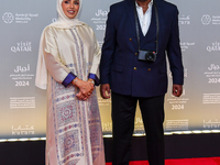 Fatma Al Remaihi, CEO of the Doha Film Institute, and Misan Harriman attend the ''Sudan, Remember Us'' red carpet during the screening on th...